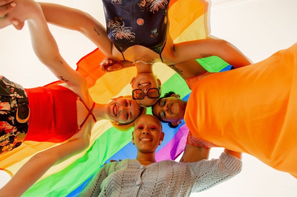 Queer individuals together in a circle